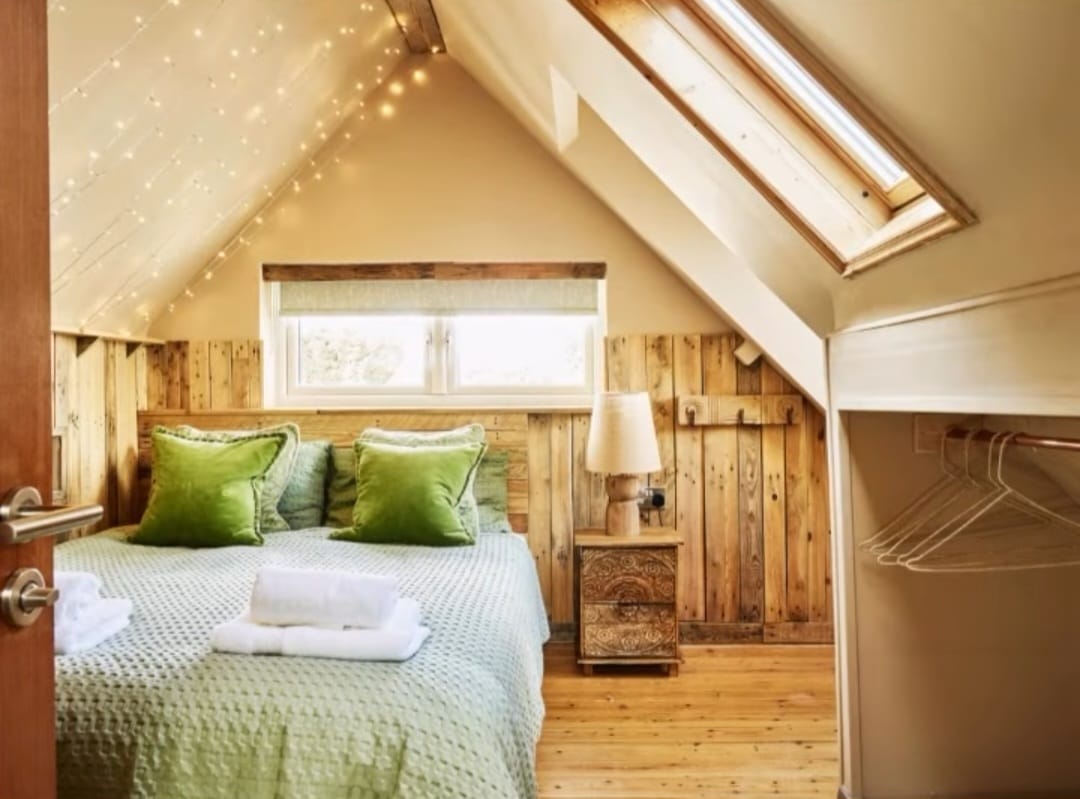 Another cozy bedroom with green pillows