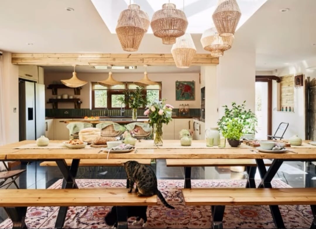 A spacious kitchen and dining area with natural wood elements